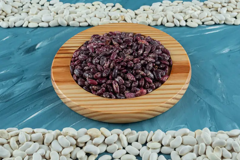 bunch-various-raw-beans-scattered-blue-surface 