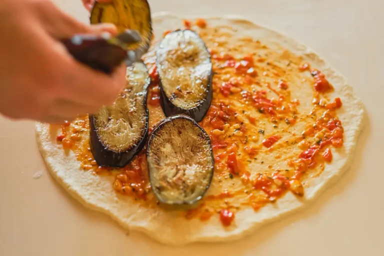 A delicious and cruelty-free twist on a classic dish: vegan eggplant parmesan made with plant-based cheese, aquafaba breading, and savory marinara sauce.